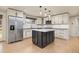 Updated kitchen featuring granite counters, stainless appliances and a kitchen island at 4629 Estes St, Wheat Ridge, CO 80033