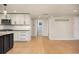 Modern kitchen with white cabinets, granite countertops, and stainless steel appliances at 4629 Estes St, Wheat Ridge, CO 80033
