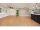 Spacious living room showcasing hardwood floors and an open layout to the kitchen at 4629 Estes St, Wheat Ridge, CO 80033