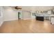 Spacious living room showcasing hardwood floors and an open layout to the kitchen at 4629 Estes St, Wheat Ridge, CO 80033