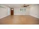 Bright living room with beautiful hardwood floors and modern window shutters at 4629 Estes St, Wheat Ridge, CO 80033