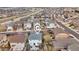 Aerial view of a light grey home, surrounded by homes, and marked with a locator icon at 3129 Open Sky Way, Castle Rock, CO 80109
