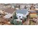 Aerial view of a light grey home with a spacious backyard with a patio, grill and pergola surrounded by fences at 3129 Open Sky Way, Castle Rock, CO 80109