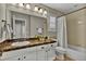 Bathroom with granite countertops, white cabinets, and a shower with a white curtain at 3129 Open Sky Way, Castle Rock, CO 80109