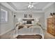 Neutral bedroom features a bed with decorative pillows, nightstands and neutral decor with carpeted floors at 3129 Open Sky Way, Castle Rock, CO 80109