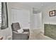Bedroom featuring a cozy gray reading chair and storage in hall at 3129 Open Sky Way, Castle Rock, CO 80109