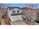 Charming two-story home with a well-manicured lawn, inviting curb appeal, and attached two car garage at 3129 Open Sky Way, Castle Rock, CO 80109