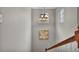 Bright stairway features a chandelier, white walls, and wood railing at 3129 Open Sky Way, Castle Rock, CO 80109