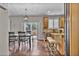 Stylish kitchen featuring hardwood floors, granite countertops, stainless steel appliances, and a breakfast bar at 3129 Open Sky Way, Castle Rock, CO 80109