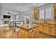Open-concept kitchen with granite countertops, and an adjacent dining area and living room at 3129 Open Sky Way, Castle Rock, CO 80109