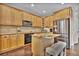 Well-appointed kitchen featuring an island, stainless steel appliances, and granite countertops at 3129 Open Sky Way, Castle Rock, CO 80109