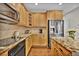 Modern kitchen featuring granite countertops, stainless steel appliances, and hardwood floors at 3129 Open Sky Way, Castle Rock, CO 80109
