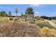 Sign for Deputy Zack S. Parrish III Memorial Park, set amidst natural grasses, plants, and a clear sky at 3129 Open Sky Way, Castle Rock, CO 80109