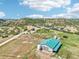 Expansive property featuring a home and large outbuilding, set against a scenic hillside at 5285 E State Highway 86, Franktown, CO 80116
