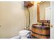 Unique powder room featuring a barrel sink, and wood accents creating a rustic and charming design at 5285 E State Highway 86, Franktown, CO 80116