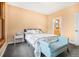 Cozy bedroom with a sitting area, light-colored walls, and ensuite bathroom access at 5285 E State Highway 86, Franktown, CO 80116