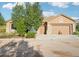 Charming one-story house with a three-car garage and mature trees enhancing curb appeal at 5285 E State Highway 86, Franktown, CO 80116