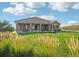 Well-maintained backyard with a patio and lush grassy area, perfect for outdoor enjoyment at 5285 E State Highway 86, Franktown, CO 80116