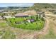 Stunning property featuring a sprawling lawn, mature trees, garden, and beautiful outdoor living space at 5285 E State Highway 86, Franktown, CO 80116
