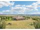 Expansive single-story home showcasing the surrounding landscape with a tile roof at 5285 E State Highway 86, Franktown, CO 80116