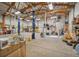 Bright garage interior showcasing ample storage, an auto lift, and large workbench area at 5285 E State Highway 86, Franktown, CO 80116