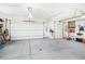 Bright garage with ample space for vehicles and storage, including side utility door at 5285 E State Highway 86, Franktown, CO 80116