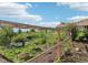 Lush garden with a wire fence enclosing a variety of plants, and mulch ground cover at 5285 E State Highway 86, Franktown, CO 80116