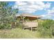 Outdoor gazebo surrounded by mature trees offering a private retreat at 5285 E State Highway 86, Franktown, CO 80116