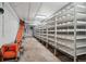 Indoor agricultural setup, featuring rows of shelves, conveyor belt, and industrial equipment at 5285 E State Highway 86, Franktown, CO 80116
