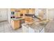 Spacious kitchen featuring custom cabinetry, granite countertops, and stainless steel appliances at 5285 E State Highway 86, Franktown, CO 80116