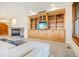 Cozy living room with custom built-ins, stone fireplace, and comfortable seating at 5285 E State Highway 86, Franktown, CO 80116