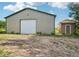 Exterior view of an outbuilding with a garage door and small adjacent structure at 5285 E State Highway 86, Franktown, CO 80116