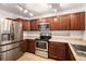 Functional kitchen with stainless steel appliances, ample cabinet space, and tile flooring at 1509 S Florence Ct # 218, Aurora, CO 80247