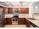 Stainless steel appliances and tile flooring highlight this kitchen's ample cabinet space at 1509 S Florence Ct # 218, Aurora, CO 80247