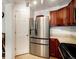 Kitchen with stainless steel fridge and tile floors at 1509 S Florence Ct # 218, Aurora, CO 80247