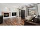 Spacious living room with hardwood floors, fireplace, and multiple windows at 1509 S Florence Ct # 218, Aurora, CO 80247
