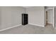 Cozy bedroom includes modern grey carpet and a practical built-in shelving unit at 14001 E Marina Dr # 603, Aurora, CO 80014