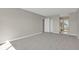 Comfortable bedroom space with soft carpet, a closet, and soothing neutral tones throughout at 14001 E Marina Dr # 603, Aurora, CO 80014