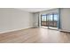 Spacious bedroom features hardwood floors and a sliding glass door to the balcony at 14001 E Marina Dr # 603, Aurora, CO 80014