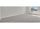Bedroom featuring a window with a view and neutral-colored carpet at 14001 E Marina Dr # 603, Aurora, CO 80014