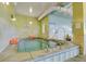 Indoor hot tub room with tiled walls and spa rules posted at 14001 E Marina Dr # 603, Aurora, CO 80014
