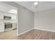 An open living space with wood floors and adjacent kitchen featuring stainless appliances at 14001 E Marina Dr # 603, Aurora, CO 80014