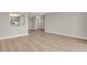 An open living space with wood floors next to the kitchen area at 14001 E Marina Dr # 603, Aurora, CO 80014