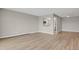 Spacious living area with hardwood floors and an open view into the kitchen at 14001 E Marina Dr # 603, Aurora, CO 80014