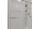 Modern shower with glass doors and a multi-setting shower head and grab bar at 14001 E Marina Dr # 603, Aurora, CO 80014