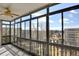 Bright sunroom featuring large windows with picturesque neighborhood views and natural light at 14001 E Marina Dr # 603, Aurora, CO 80014
