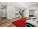 Expansive basement with wood floors and a wet bar area, ideal for entertaining and relaxation at 6532 S Tempe St, Aurora, CO 80016