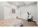 Comfortable bedroom with neutral colors, exercise equipment, and ample closet space for organization at 6532 S Tempe St, Aurora, CO 80016