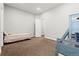 A cozy bedroom with neutral-toned walls, and carpet at 6532 S Tempe St, Aurora, CO 80016
