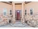 Inviting front entrance with decorative stone accents and a covered porch at 6532 S Tempe St, Aurora, CO 80016